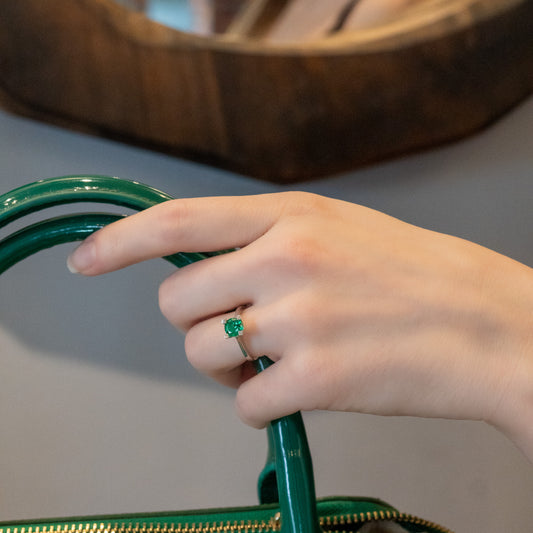 Green Zircon Solitaire Ring on black background