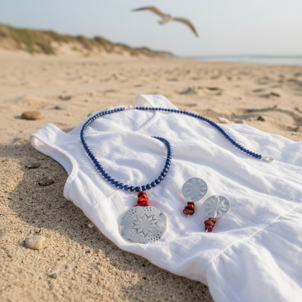 Polaris Necklace on white fabric at the beach - navy stone strand cord with matching earrings